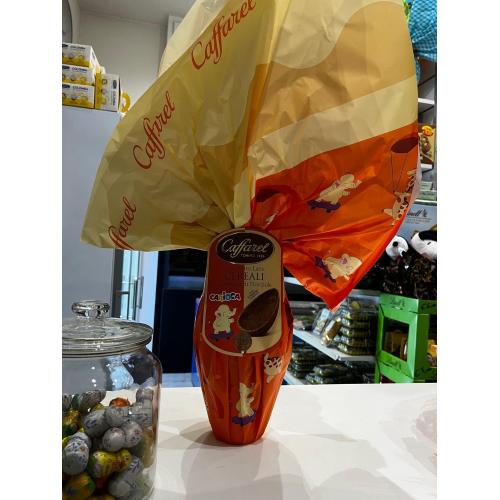 Uovo Cioccolato al latte con cereali e granella di nocciole CAFFAREL con sorpresa Carioca
