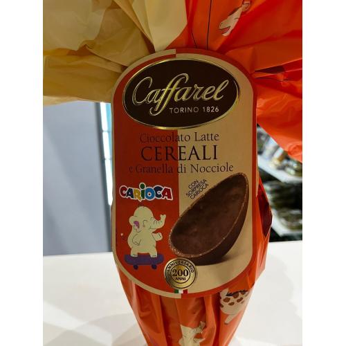Uovo Cioccolato al latte con cereali e granella di nocciole CAFFAREL con sorpresa Carioca